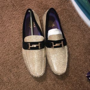 Gold and black loafers